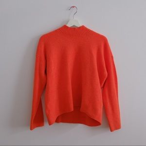 medium orange uniqlo sweater with small mockneck